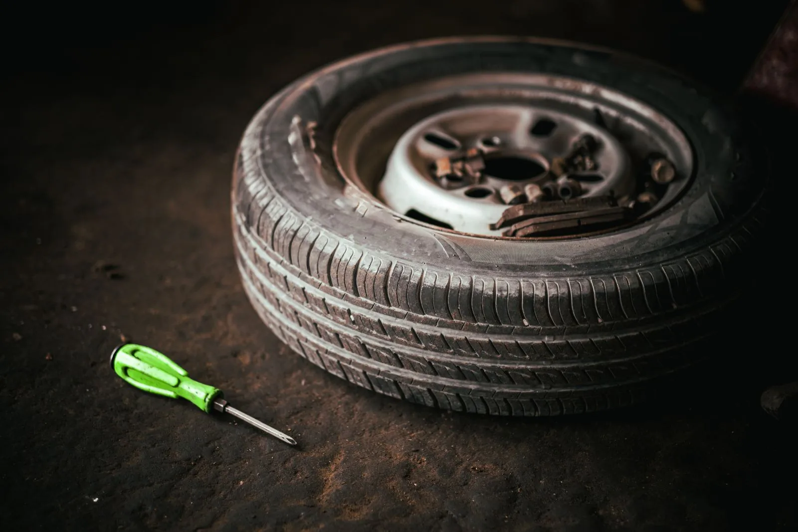 Steering & suspension repair — suspension components viewed from below on a lift
